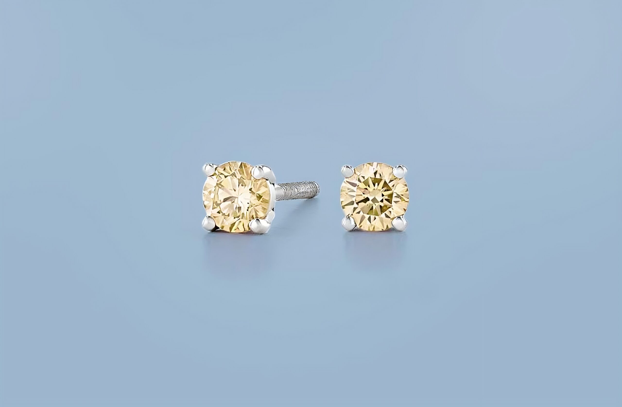 yellow fancy color diamond studs