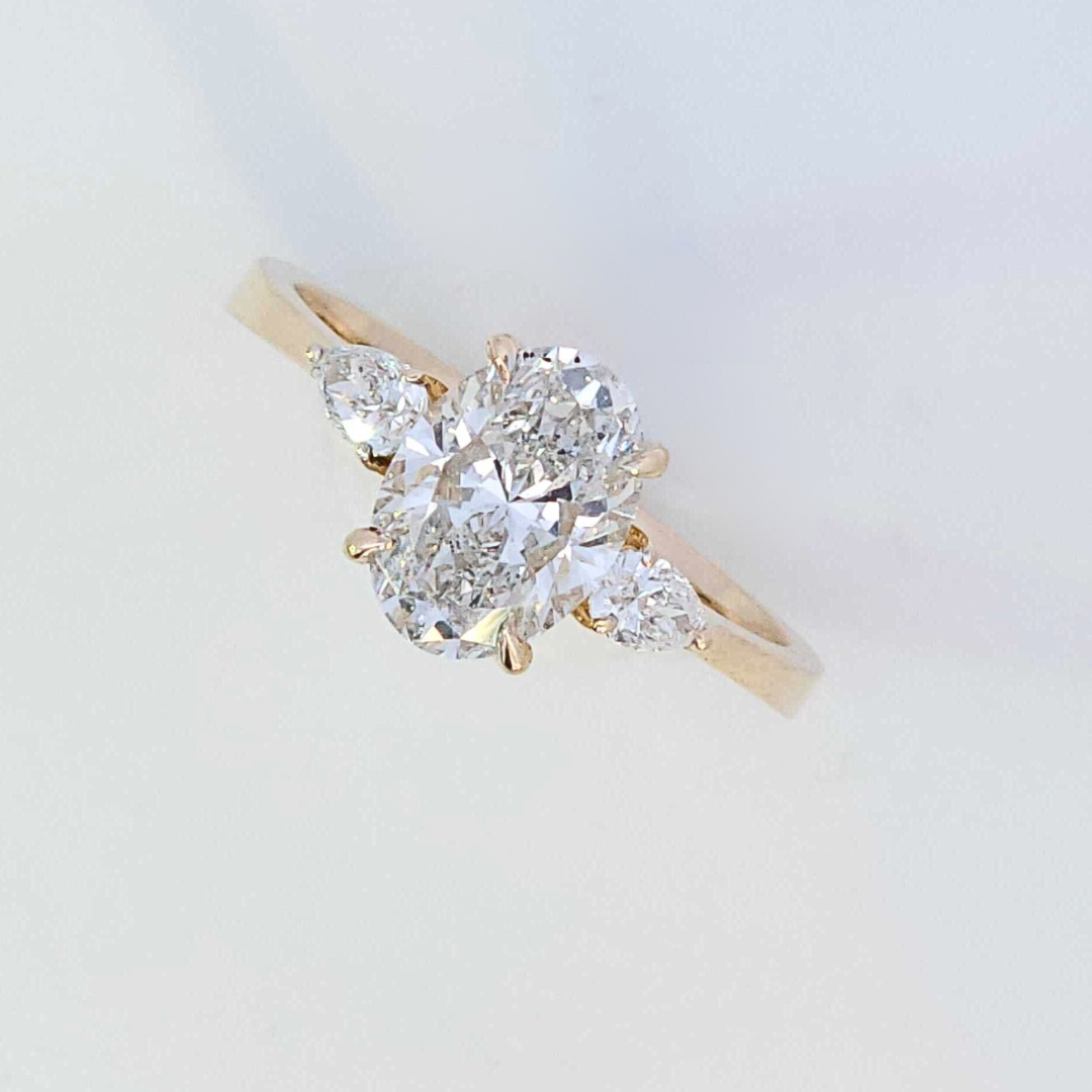 oval three stone diamond ring