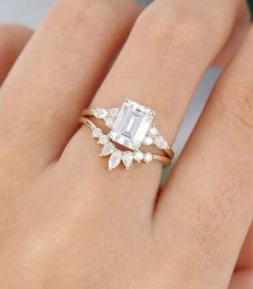 emerald cut engagement ring with Lunette wedding band